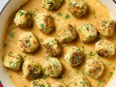 a pan filled with meatballs and gravy