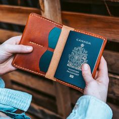 a person holding a canadian passport in their hand