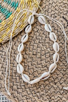 The perfect finishing touch, this necklace features cowrie shells on a cord in an adjustable fit. Add these to your jewellery for some added boho feels. Handmade Necklace Boho Style Size: Adjustable size Material: Cowrie shells Colour: Cream Why We Love It: Great for layering with other jewellery Boho Jewelry Ideas, Handmade Seashell Jewelry, Shells Craft, Shells Necklace, Ankle Bracelets Boho, Preppy Birthday, Girly Bracelets, Meat Skewers