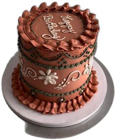 a three tiered cake decorated with flowers and words on the top, sitting on a plate