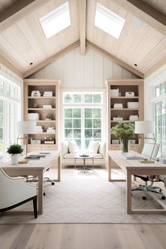 an office with two desks and chairs in the middle of it, along with open shelving