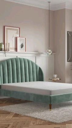 a bed with a green velvet headboard and foot board in a pink walled room