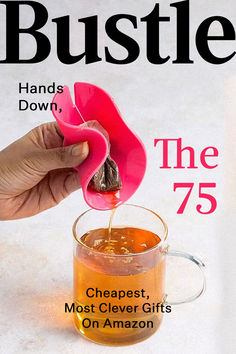 a person pouring tea into a cup with the cover of bustle magazine on it