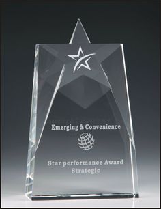 an award is shown with the star on it's glass base, which reads emerging & convenience