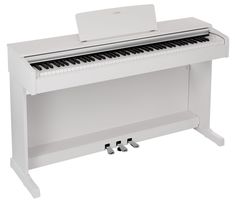 a white piano sitting on top of a table