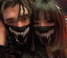 two people with face coverings on their faces and one is wearing a black mask