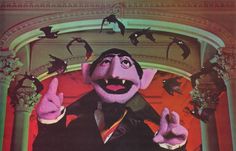 an image of a man in costume with bats flying around him and pointing at the camera