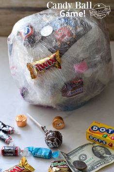 a bag filled with candy sitting on top of a table next to other candies