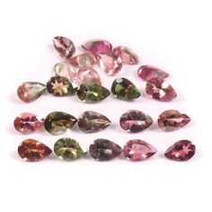 many different colored diamonds on a white surface