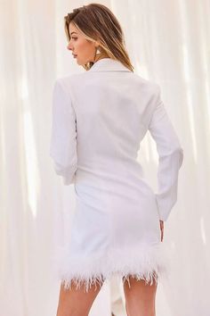 This chic off-white feather trim blazer dress is a must-have for any sophisticated wardrobe. Tailored from crepe-backed satin, this luxuriously comfortable dress is adorned with delicate feather trim that adds a beautiful finishing touch. Wear to a special occasion for an effortlessly glamorous look. Collar Neck Off white Shoulder Pad Bottom Feather Trim Double Button Solid Blazer Dress 97% polyester 3% span