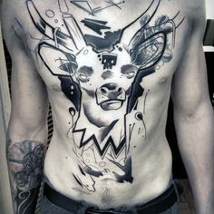 a man with tattoos on his chest has an image of a cow's head