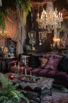 a living room filled with lots of furniture and chandelier hanging from the ceiling