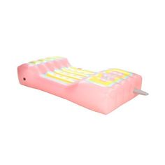 an inflatable mattress is laying on its side with a toothpick sticking out of it