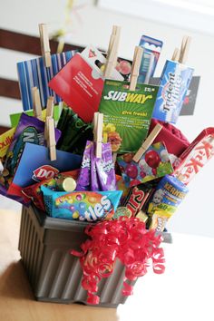 a basket filled with candy and candies on top of a table