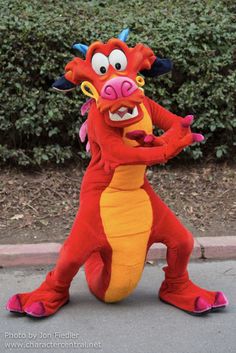 a red dragon mascot standing on its hind legs