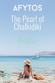 a woman sitting on top of a sandy beach next to the ocean with text overlay reading afyros the pearl of chakiki