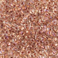 pink seed beads are shown in close up