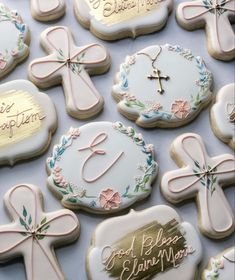 decorated cookies with names and cross on them