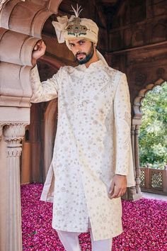 Cream sherwani with zardozi embroidered floral and bird motifs. Comes with inner kurta and churidar.
Components: 3
Pattern: Embroidered
Type Of Work: Zardozi
Neckline: Mandarin Collar
Sleeve Type: Full
Fabric: Raw Silk
Color: Cream
Other Details: 
Weight: 2 Kgs
Closure: Sherwani: Front closure
Note: Safaa, kilangi and dupatta worn by the model is not for sale
Occasion: Wedding,Destination Wedding,Groom - Aza Fashions Cream Sherwani, Bird Motif, Wedding Destination, Churidar, Wedding Groom, Embroidered Silk, Raw Silk, Mandarin Collar, Aza Fashion