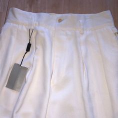 Classic Georgio Armani Trousers 35” Unfinished Length 9.5” Bottom Leg Measurement Loops For A Belt On The Waistband And Side Hip Buckled For Decoration Made In Italy High Waisted With Side Pockets 1 Outside Back Pocket One Of The Belt Loops (As Shown) Has Dark Mark On It White Pants With Welt Pockets For Summer, White Tapered Leg Dress Pants For Summer, Elegant Tapered Long Pants, White Dress Pants With Tapered Leg And Pockets, White Tapered Leg Dress Pants With Pockets, White Relaxed Fit Formal Bottoms, Formal White Bottoms With Belt Loops, Elegant Tapered Bottoms For Summer, Tailored White Pants With Pockets