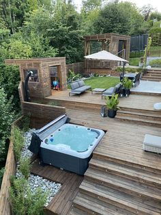 a hot tub sitting on top of a wooden deck