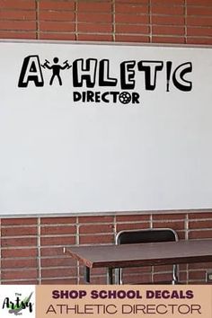 a whiteboard with the word athletic director on it in front of a brick wall