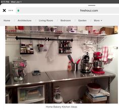 a kitchen with stainless steel counter tops and shelves