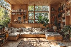 a living room filled with lots of furniture and bookshelves next to a window