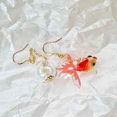 🍀 Size: 7 x 1.8 cm 🍀 Material: 14K Gold Plated Sterling Silver Hook, Glass, Resin (✨Hypoallergenic Hook✨) Description  🌸 Dive into the world of whimsy with our Kawaii Japanese Goldfish and Glass Tank Earrings! These funky dangle & drop earrings capture the charm of a serene fish tank. A unique and creative piece of jewelry, perfect as a gift for Mom or Her, they add a touch of cuteness and creativity to any outfit. 🌸 ⭐️ Shop more styles at https://etsy.com/uk/shop/StrawberryAtoll. ⭐️ * Shipp Handmade Fish-shaped Earrings For Gifts, Gold Fish-shaped Earrings With Fish Hook, Gold Fish-shaped Earrings, Gold Fish-shaped Pierced Earrings, Elegant Gold Fish-shaped Earrings, Fish Hook Drop Earrings As A Gift, White Fish Hook Earrings As Gift, Drop Earrings Jewelry With Fish Hook As Gift, Earrings Kawaii