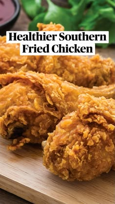 fried chicken on a cutting board with dipping sauce