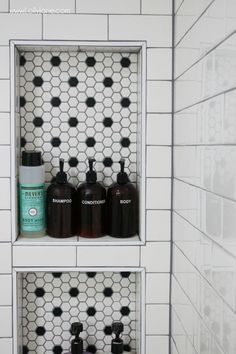 the shelves in the bathroom are filled with soaps and lotion bottles on them