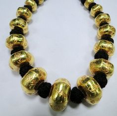 22 K gold Large beads Necklace. Handmade beautiful hollow Gold beads filled with wax inside to give more striength and durablity. Good for wear as is or for your own creation. Length-27 cm ( free size easy to adjust length by pulling the toggle), size of center bead-15/20 MM, Weight-77 grams. Material-22 K gold. Handmade Spiritual Temple Necklace For Festive Occasions, Gold Spiritual Jewelry With Latkans, Spiritual Gold Jewelry With Latkans, Temple Jewelry Necklaces With Gold Beads For Rituals, Gold Necklace With Round Beads For Diwali, Gold Necklace With Intricate Design For Puja, Traditional Gold Necklace With Locket, Brass Temple Necklace With Intricate Design For Puja, 22k Gold Spiritual Necklaces For Rituals