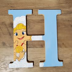 the letter h is made up of wood and has an image of a cartoon character