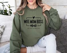 Stay in 'Wife Mom Boss' Mode with this Trendy, Comfy Sweatshirt - Perfect Gift for Busy Moms! Introducing our Wife Mom Boss Mode Sweatshirt, the perfect apparel for all the fierce women out there! This sweatshirt is not just a clothing item, but a declaration of your multitasking skills and incredible power. Made with utmost comfort in mind, this sweatshirt will keep you cozy while you conquer the world in wife, mom, and boss mode. Crafted from high-quality materials, it features a stylish desig Women Boss, Birth Doula, Fierce Women, Conquer The World, Sweatshirt Women, Sweater Gift