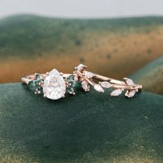 Pear shaped Moissanite ring set Vintage Rose gold Engagement ring set Marquise cut Moss agate ring Leaf wedding ring set Women Promise ring ----------Rings Details ---------- The Engagement Ring: ☆Center stone: Moissanite ☆Size: 6*8mm ☆Cut Type: Pear cut ☆Green stones: Moss agate ☆Stone weight: About 0.28ct ☆Band Width: Approx. 1.5mm ☆Band Thickness: Approx. 1.2mm ☆Height of Stone setting: 5.3mm The Wedding Band: ☆Stone: Natural Diamonds or Moissanite ☆Stone weight: about 0.28ct ☆Band Width: App Leaf Wedding Ring Set, Leaf Wedding Ring, Rose Gold Engagement Ring Set, Gold Engagement Ring Set, Rose Gold Engagement Ring Vintage, Moissanite Ring Set, Vintage Rose Gold, Moss Agate Ring, Full Eternity Ring