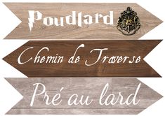 three wooden signs that say poulard, chemin de troperes and pre au land