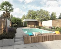 a pool surrounded by trees and plants next to a wooden bench with pillows on it