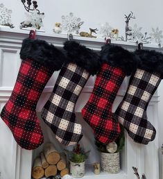 two christmas stockings hanging from a mantle