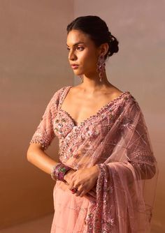 Capture elegance with this rose pink net sari adorned with metallic rose gold and gray sequins, complemented by intricate beaded embroidery. Complete the look with an elbow-length, fully embroidered sleeveless blouse, perfect for a sophisticated and glamorous ensemble. Net Sari, Pink Sari, Metallic Rose Gold, Pink Fabric, Photographic Lighting, Rose Pink, Sleeveless Blouse, Beaded Embroidery, Passion For Fashion