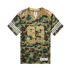 Find BAPE X Adidas Sb Jersey on Editorialist. BAPE reunites with adidas to create this SB Jersey for the SS19 season. Designed in green camouflage, the short-sleeve top nods to classic football jerseys with striped cuffs and a number on the front. Casual Camouflage T-shirt For Sports, Casual Camouflage Sports T-shirt, Camouflage Short Sleeve Sports Top, Sporty Khaki Tops For Streetwear, Military Style Green Tops For Streetwear, Sporty Khaki Tops, Sporty Khaki Tops For Sports, Green T-shirt With Three Stripes Branding For Sports, Camouflage Military Style Tops For Streetwear