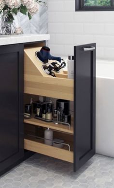 an open cabinet in a bathroom next to a bath tub