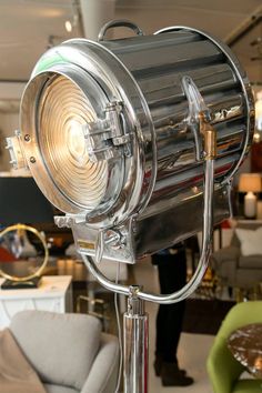 a large metal light sitting on top of a table