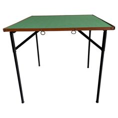 a green table with two black legs and a wooden top on an isolated white background