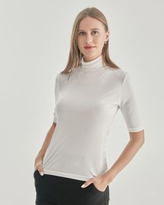 Grade 6A Mulberry Silk Breathable & Lightweight Lightweight & Comfortable Type: Silk T-ShirtMaterial: 92% Mulberry Silk + 8% Spandex Features: Satin, wear-resistant and stylish.Details: The snug fit of this turtleneck T-shirt accentuates your curves, highlighting your feminine silhouette in the most flattering way. The intricate knit pattern adds a touch of texture and depth, making this garment a standout piece in your collection. Indulge in the sumptuous softness of the knitted fabric against Short Sleeve Turtleneck, Knitted Turtleneck, Silk T Shirt, Turtleneck T Shirt, Feminine Silhouette, Knit Pattern, Knit Shorts, Mulberry Silk, Knit Patterns