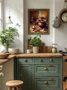 a kitchen with green painted cabinets and wooden counter tops next to a clock on the wall