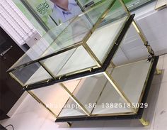 a glass display case sitting on top of a tiled floor