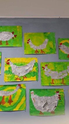 several pieces of paper cut out to look like chickens on green and yellow papers with red spots