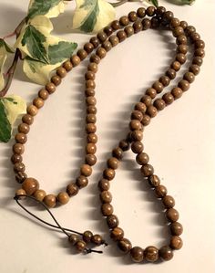 Natural Agar Wood Dark 108 beads Mala Prayer Rosary Necklace Bracelet Buddhist 108 Beads, grams 46 grams size 9mm Yoga Mantra Handmade Agarwood is a fragrant dark resinous wood used in incense, perfume, and small carvings. First-grade agarwood is one of the most expensive natural raw materials in the world,[4] with 2010 prices for superior pure material as high as US$100,000/kg, although in practice adulteration of the wood and oil is common, allowing for prices as low as US$100/kg One of the ma 8mm Round Beads For Festivals, Hand-strung Mala With Round Beads As Gift, Wooden Beads Rosary For Meditation, Hand-strung Mala Beads As Gift, Hand-strung Round Beads Mala As Gift, Adjustable Polished Beads Rosary For Meditation, Adjustable Rosary With Polished Beads For Meditation, Brown Healing Rosary With Round Beads, Healing Brown Rosary With Round Beads