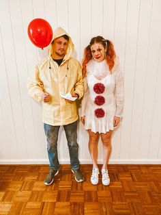 a man and woman dressed in costumes standing next to each other on a wooden floor