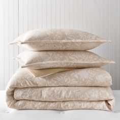 four pillows stacked on top of each other